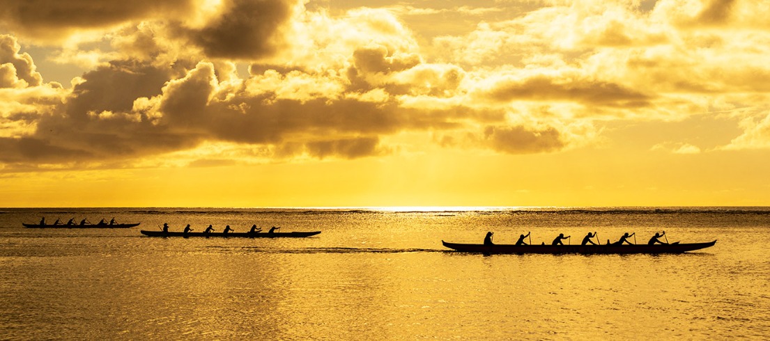 Boats on the water at sunset.